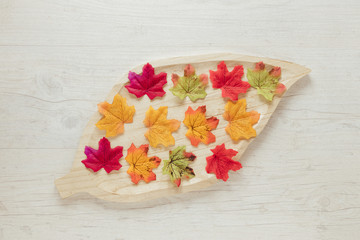 Top view autumn leaves with wooden background