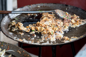 Crispy Thai Oyster Omelet in the large pan