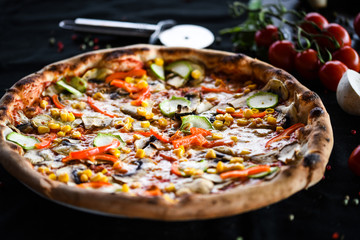 fresh italian pizza with vegetables - tomatoes, pumpkin, onion, corn & delicious cheese