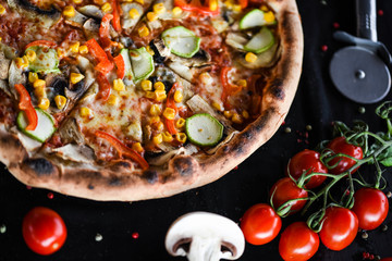 fresh italian pizza with vegetables - tomatoes, pumpkin, onion, corn & delicious cheese