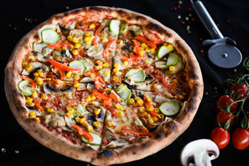 fresh italian pizza with vegetables - tomatoes, pumpkin, onion, corn & delicious cheese