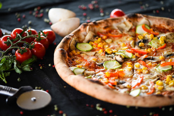 fresh italian pizza with vegetables - tomatoes, pumpkin, onion, corn & delicious cheese