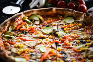 fresh italian pizza with vegetables - tomatoes, pumpkin, onion, corn & delicious cheese