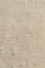 Urban concrete wall background with grooves and bubbles. Cement gray wall. Urban and industrialization art concept. Texture like concrete, stone, cement, plaster.. Poster mockup. Сloseup studio shot.