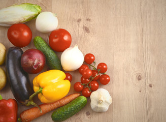 Pile of organic vegetables on a wooden table