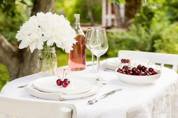 Table set with plates and flowers