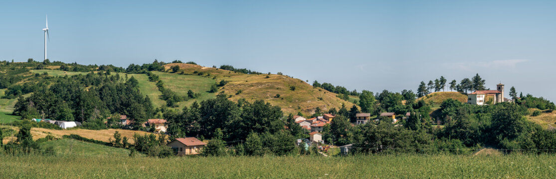 Sentiero degli Dei (Path of the Gods). Village and wind wind turbine along the Path of the Gods. San Benedetto val di Sambro, Bologna Province, Emilia Romagna, Italy.