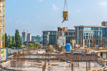 New building under construction and construction site of a residential building. Concrete work is...