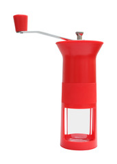 Red manual coffee grinder on white background.