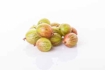 heap of green gooseberries isolated on white background