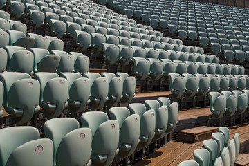 Blue empty seats in the auditorium outdoors