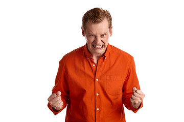 Close-up portrait of a ginger guy in orange shirt posing isolated on white background. Sincere emotions.