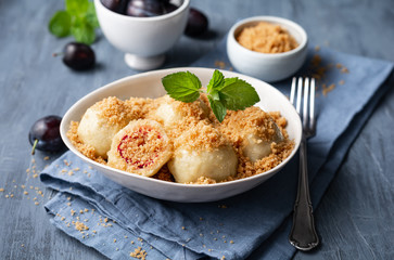 Freshly boiled plum dumplings topped with sweet toasted breadcrumbs