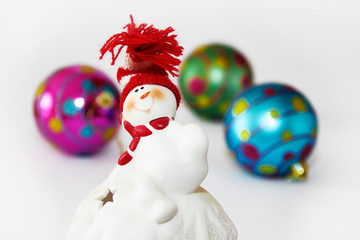 christmas toy candlestick white snowman on the background of festive new year a balls