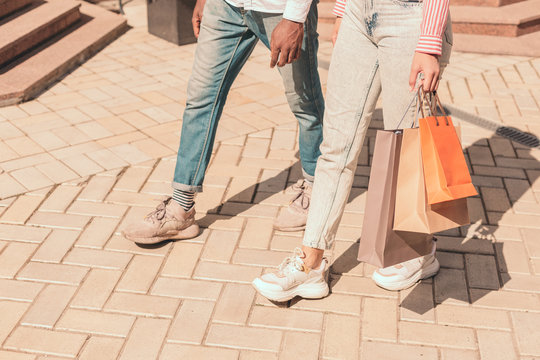 Two people walking from the shop stock photo