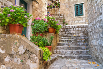 Mediterranean summer cityscape - view of a medieval street with stairs in the Old Town of Dubrovnik on the Adriatic Sea coast of Croatia