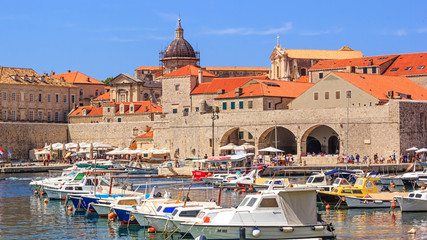 Fototapeta na wymiar Coastal summer landscape - view of the City Harbour and marina of the Old Town of Dubrovnik on the Adriatic coast of Croatia