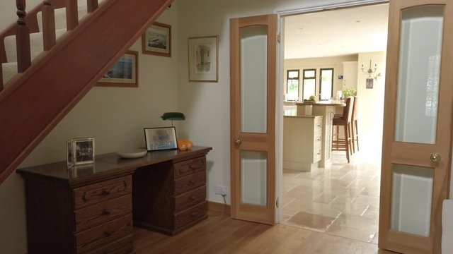 Tilt Shot of an Entrance Hall and Staircase in a Rural Home in Slow Motion