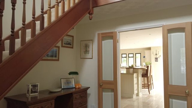 Tilt Shot of an Entrance Hall and Staircase in a Rural Home