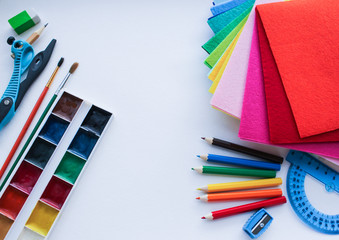 Flat lay of stationery for school and creativity, drawing and crafts on a background of white...