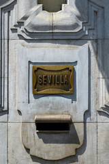 Seville spelled on a bronze plaque - 284348318