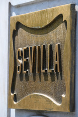 Seville spelled on a bronze plaque (close up) - 284348348