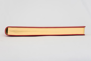 Red book, white background, horizontal, red copybook, front view