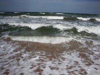 Fototapeta na wymiar Soft wave splash on sea or ocean. Incredible foamy waves