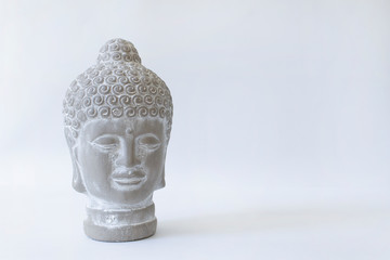 statue of buddha head meditation isolated on white background