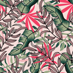 Original abstract seamless pattern with colorful tropical leaves and plants on pink background. Vector design. Jungle print. Floral background. Printing and textiles. Exotic tropics. Summer.