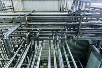 Steel pipes of industrial machinery equipment at chemical or food factory