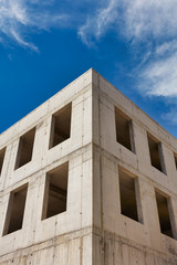 A modern concrete office building under construction