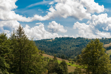 beautiful mountain landscape against the blue sky and clouds