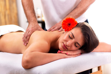 Obraz na płótnie Canvas Charming lady having a back massage