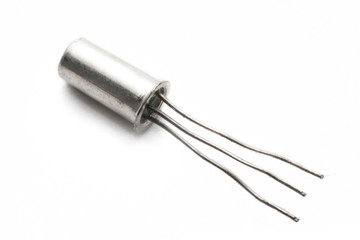 An electronic germanium transistor (ac128) isolated on white background macro shot