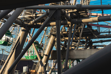 Close-up structure of a ferris wheel against clear blue sky in Osaka, Japan