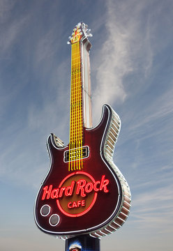 WARSAW,POLAND - 9-20-2017: Neon guitar outside the Hard Rock Cafe in Warsaw