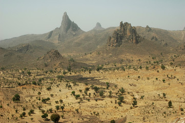 Cameroon, Rhumsiki. Rocks rising in the middle of an arid landscape