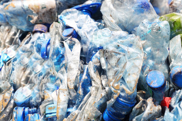 Compressed bales of plastic PET bottles ready for recycling