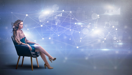 Elegant woman sitting in a sofa with network and connection concept