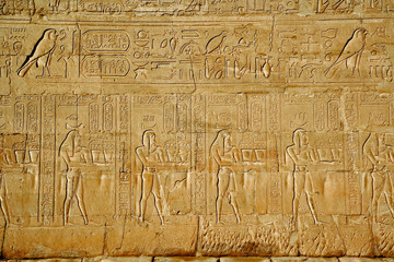 Figures and cartouches on main pylons of entrance to Temple of Horus, Edfu, Egypt