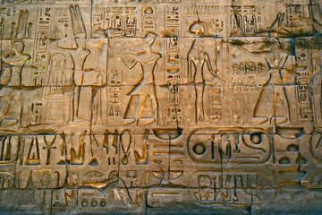 Fototapeta na wymiar Ancient hieroglyphs on wall, Temple of Karnak, located at modern day Luxor or ancient Thebes, Egypt