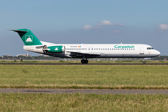 VIJFHUIZEN, THE NETHERLANDS - June 20, 2018: Romanian Carpatair Fokker F100 with registration YR-FKA just landed on runway 18R (Polderbaan) of Amsterdam Airport Schiphol.