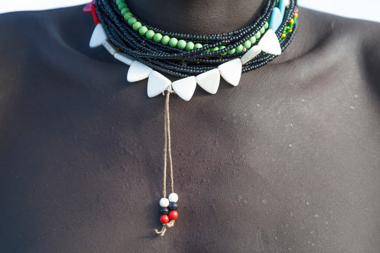 Africa, Ethiopia, Southern Omo Valley, Nyangton Tribe. Detail of a young man's necklace.