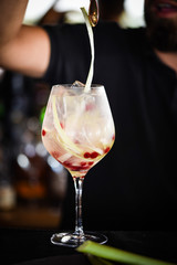 tonic gin cocktail with fresh rhubarb & red berries