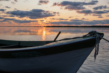 boat on lake at sunset