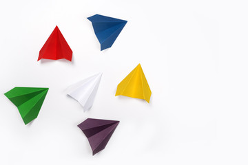 Color paper airplanes on white background. Different vision creative and Innovative solution for Business concepts.