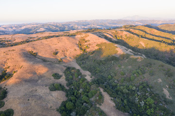 Evening light illuminates the hills, ridges, and canyons found in the East Bay near Berkeley, Oakland, and not far from San Francisco in northern California.