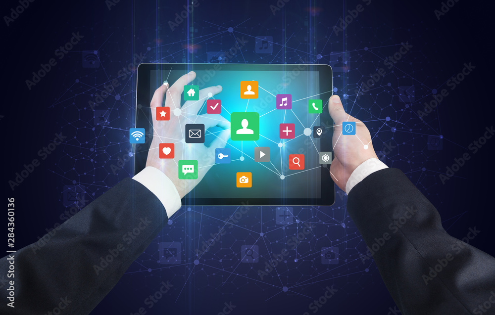 Poster Hand using tablet with colorful bounce application symbols and icons concept
