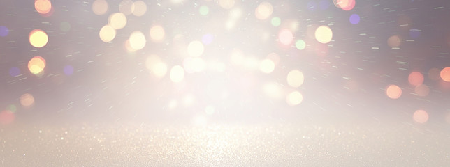 blackground of abstract glitter lights. silver and gold. de-focused. banner